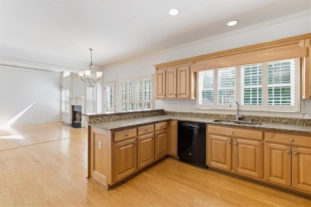 2021 Cockrell Pointe Northwest Kennesaw, GA 30152 - Photo 18 of 59 a large kitchen with granite countertop a stove and a sink