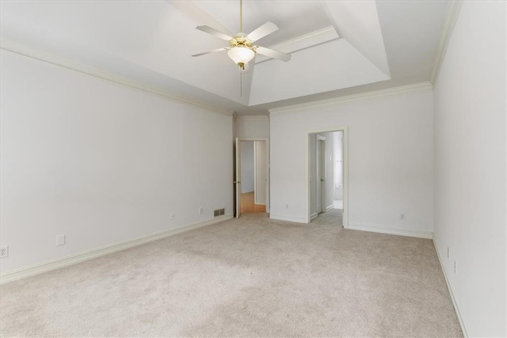 2021 Cockrell Pointe Northwest Kennesaw, GA 30152 - Photo 28 of 59 an empty room with a ceiling fan and a chandelier fan