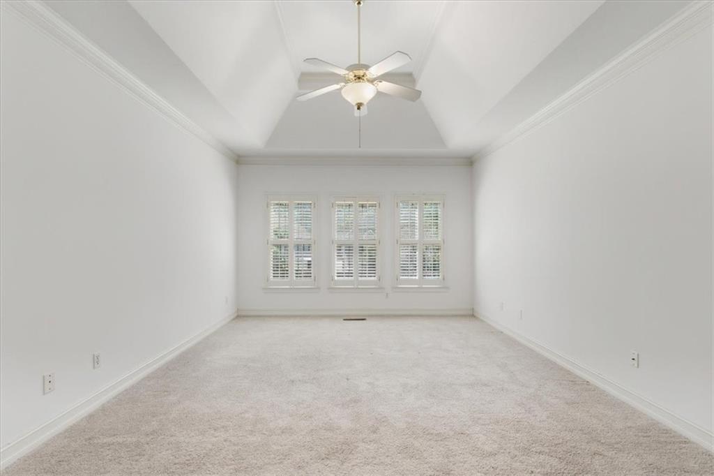 2021 Cockrell Pointe Northwest Kennesaw, GA 30152 - Photo 29 of 59 an empty room with a ceiling fan and window