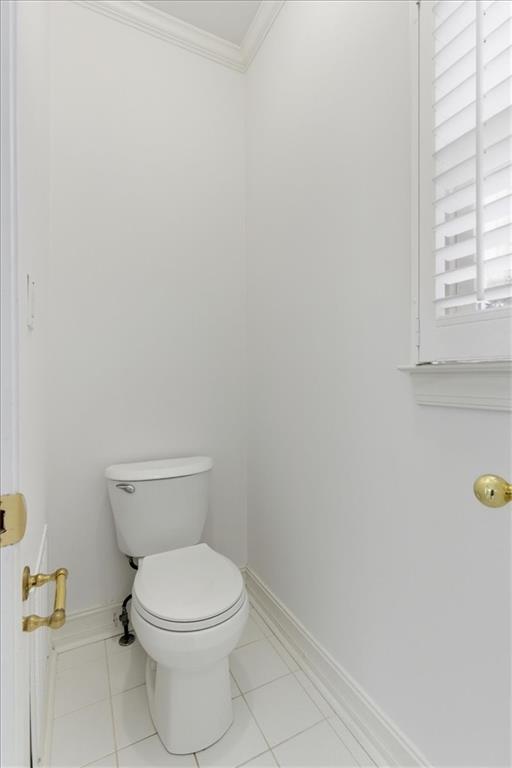 2021 Cockrell Pointe Northwest Kennesaw, GA 30152 - Photo 36 of 59 a white toilet sitting next to a window