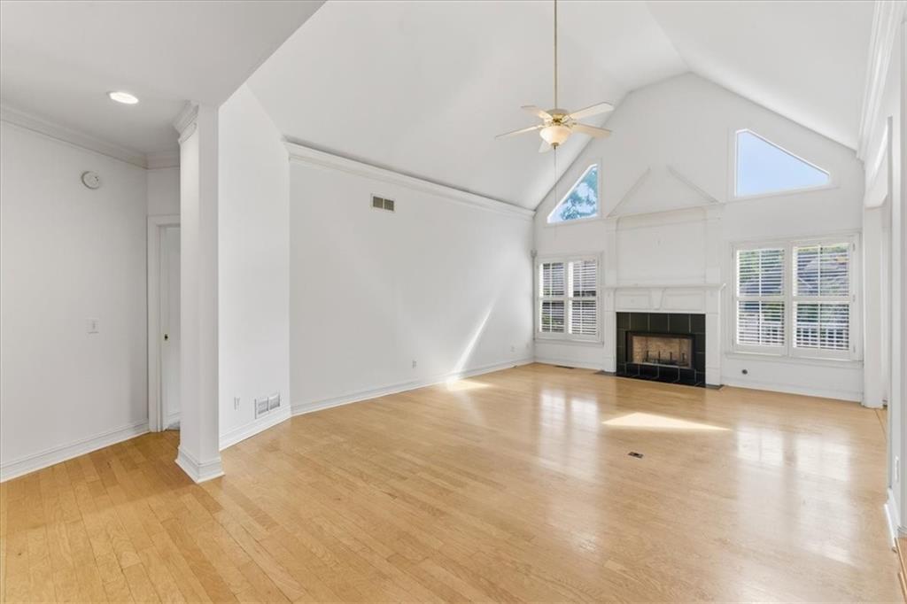 2021 Cockrell Pointe Northwest Kennesaw, GA 30152 - Photo 4 of 54 a view of empty room with wooden floor and fireplace