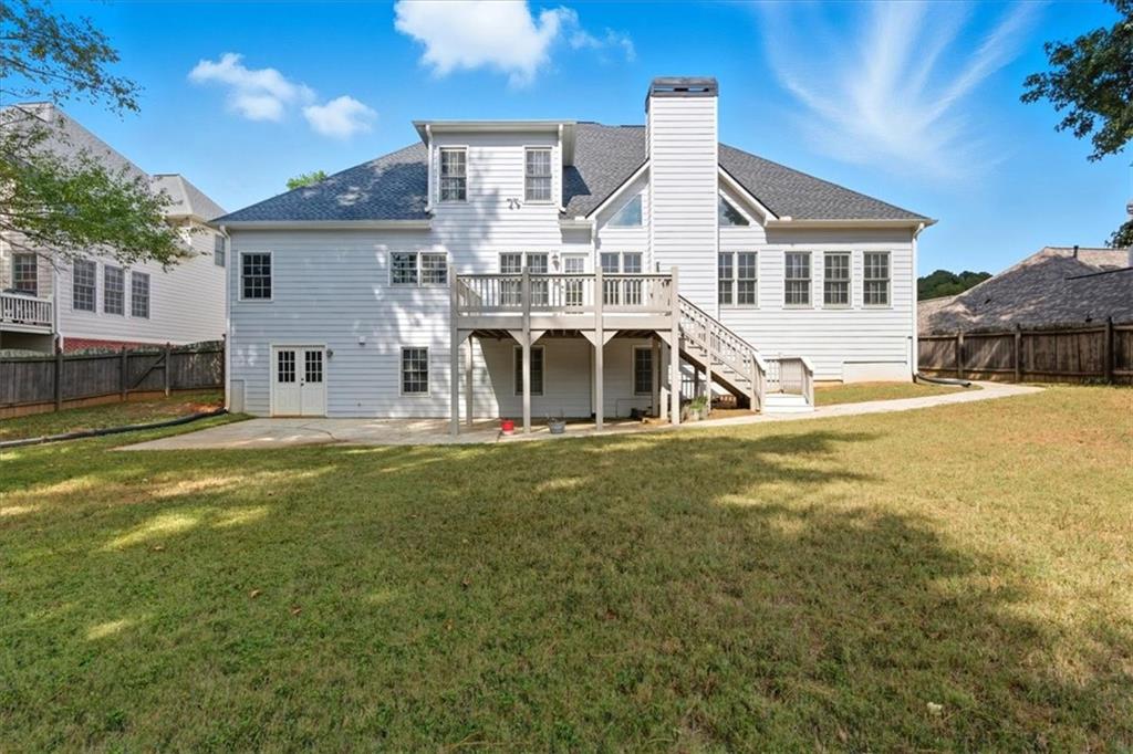 2021 Cockrell Pointe Northwest Kennesaw, GA 30152 - Photo 44 of 59 a front view of a house with a yard