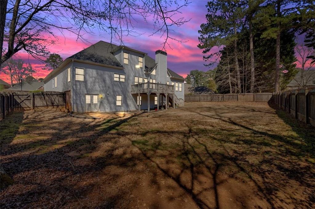 2021 Cockrell Pointe Northwest Kennesaw, GA 30152 - Photo 46 of 59 a view of a house with a yard