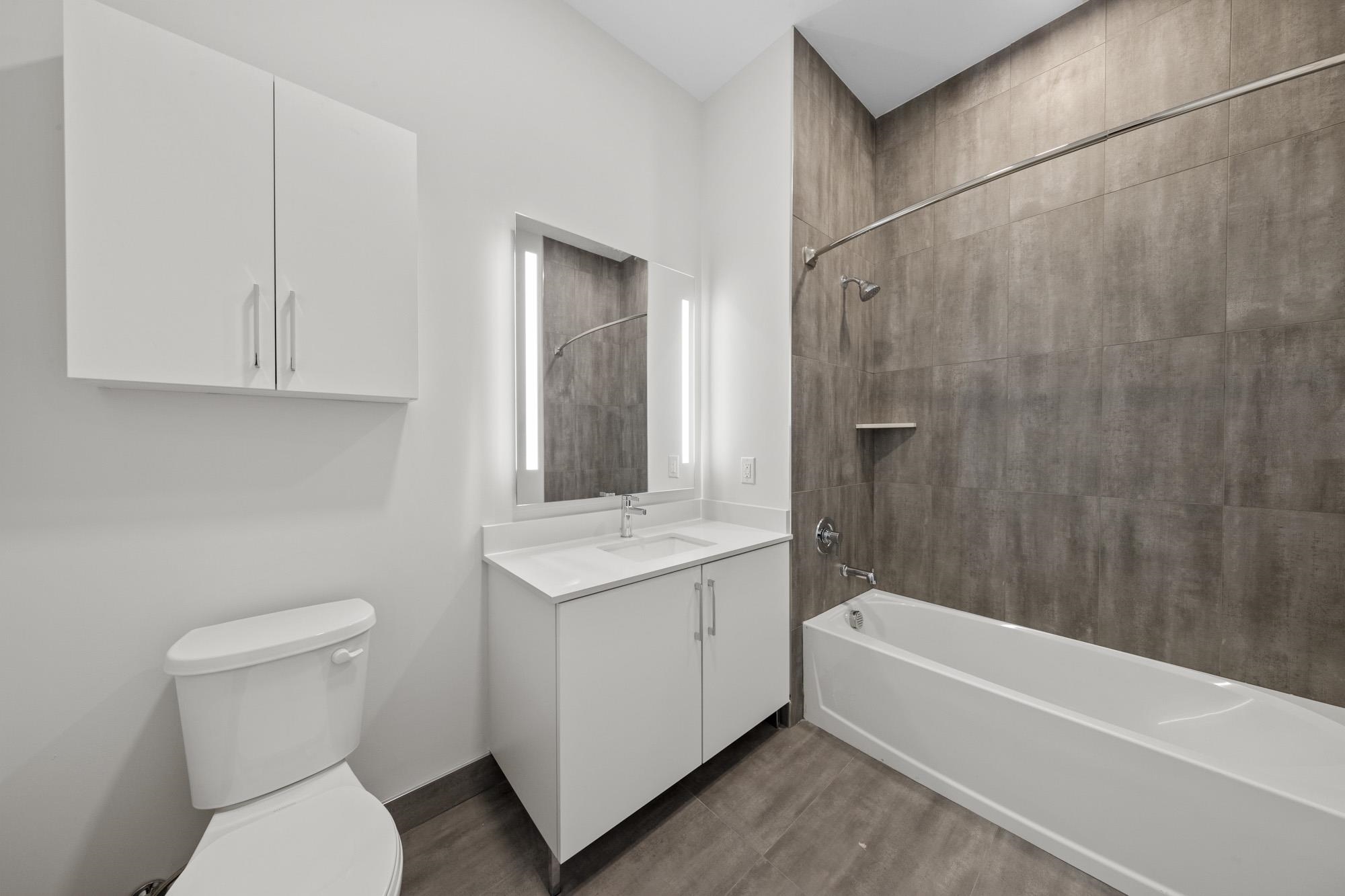 121 34th Street, Unit 604 Union City, NJ 07087 - Photo 15 of 44 a bathroom with a toilet a sink and bathtub