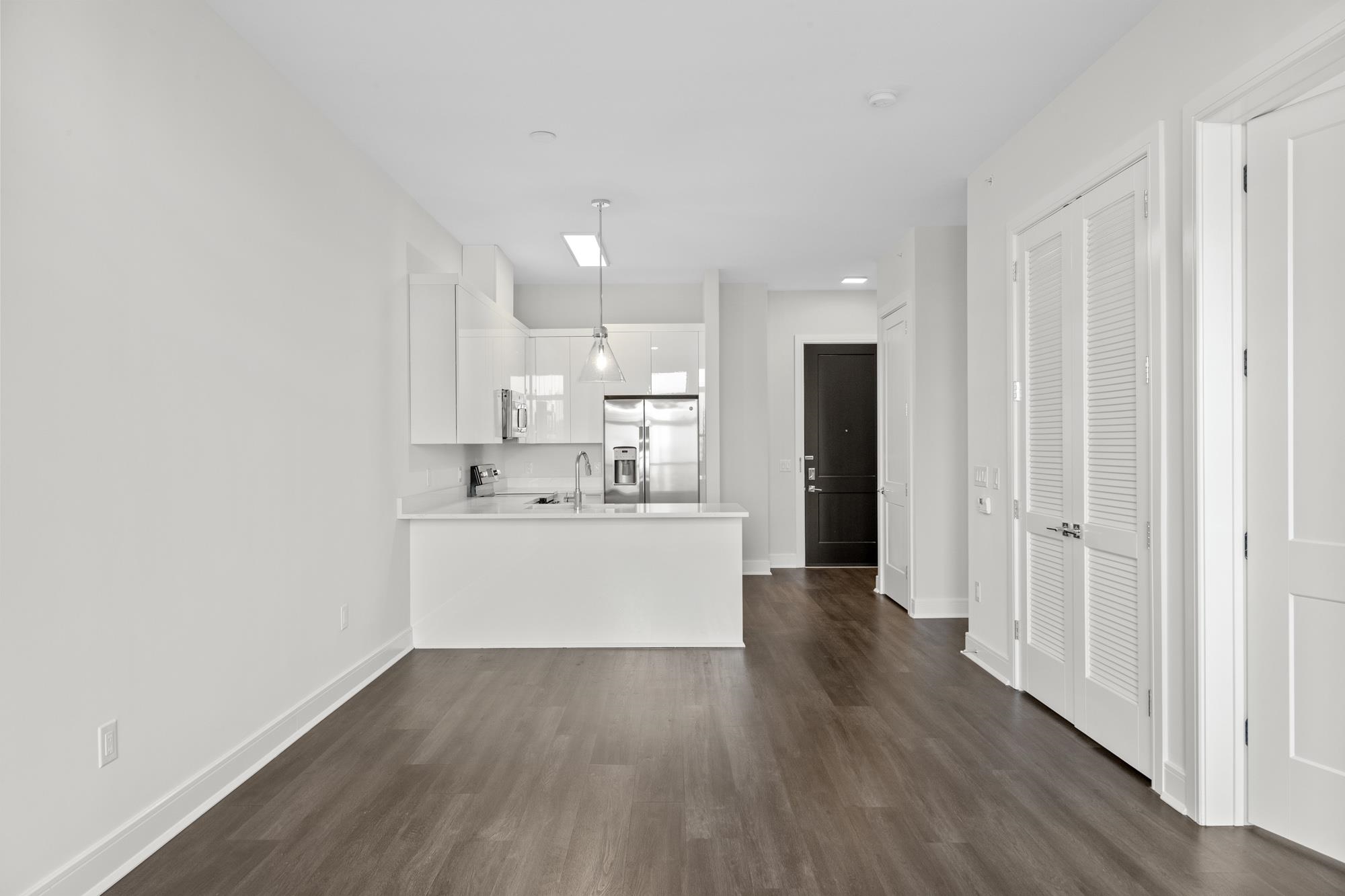 121 34th Street, Unit 604 Union City, NJ 07087 - Photo 7 of 44 a view of a kitchen with wooden floor