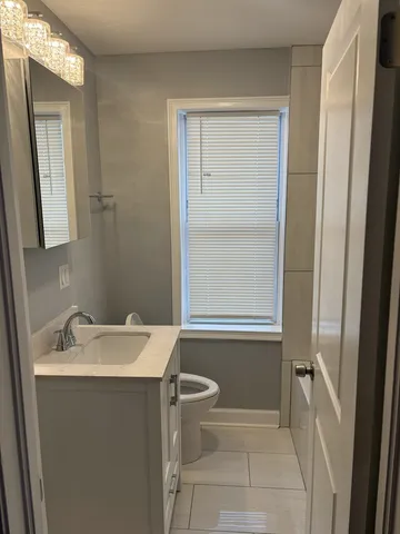 a bathroom with a sink toilet and tub