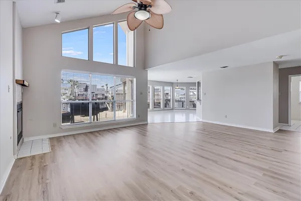 a kitchen with stainless steel appliances granite countertop a stove refrigerator sink and microwave