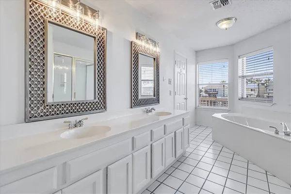 a view of an entryway with wooden floor and a next to a window