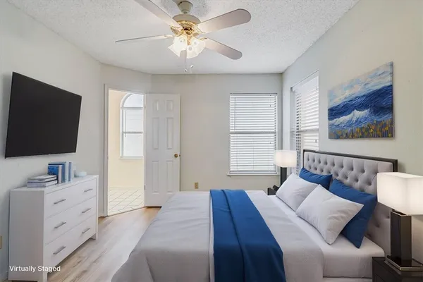 a bathroom with a toilet a sink and a window