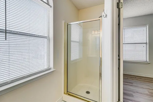 a bedroom with a bed and a book shelf