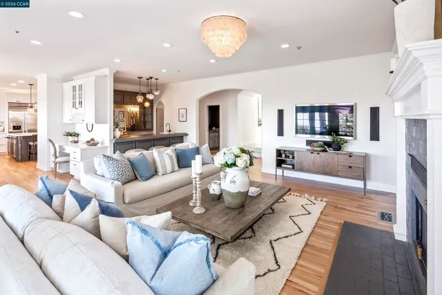a living room with fireplace furniture and a flat screen tv