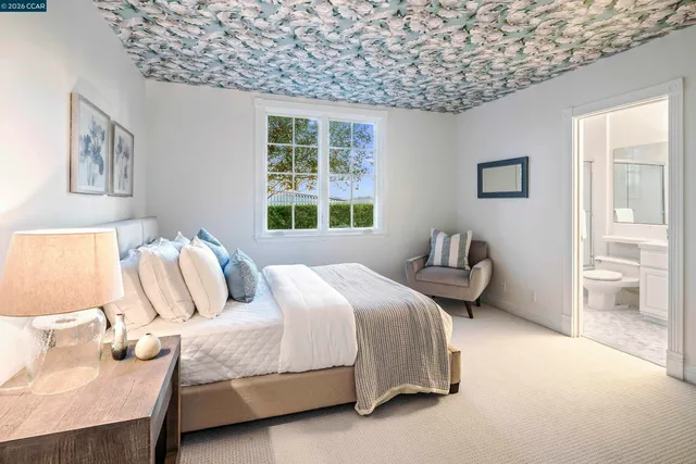 a bedroom with bed and a window