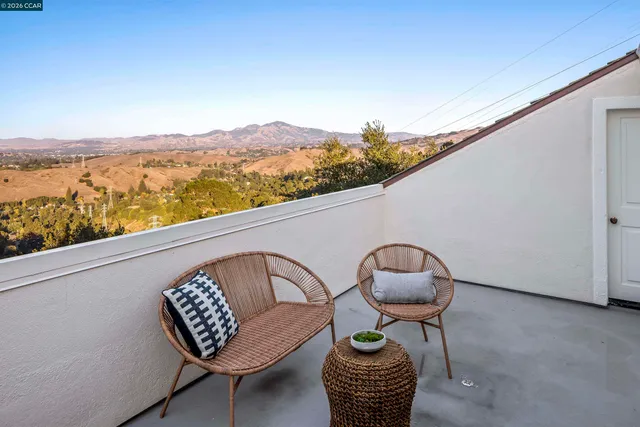 a view of roof deck with furniture