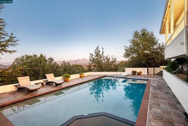 a view of a swimming pool with a patio