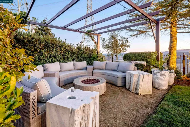 a balcony with furniture and a potted plant