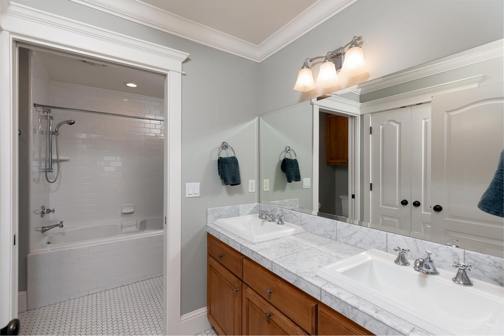 3917 Mainsail Place Soquel, CA 95073 - Photo 30 of 43 a bathroom with a granite countertop sink mirror and shower