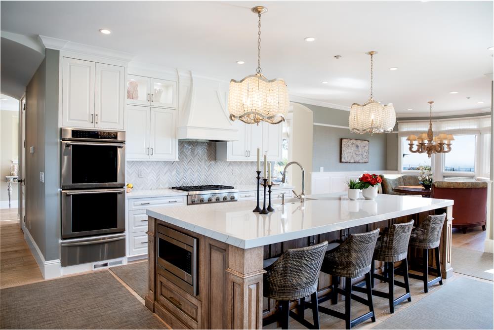 3917 Mainsail Place Soquel, CA 95073 - Photo 6 of 43 a kitchen with a dining table chairs stainless steel appliances and cabinets