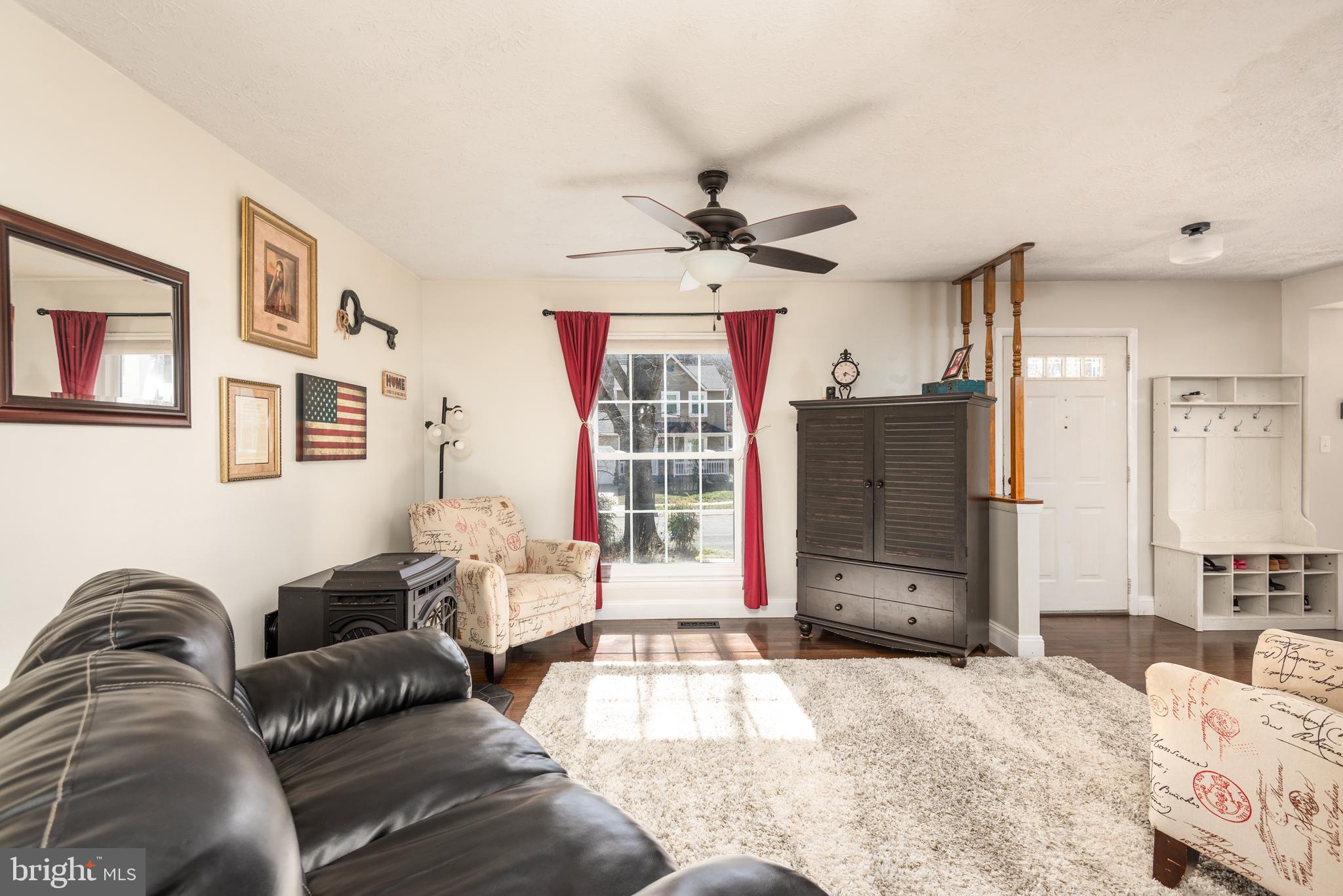 48 Fox Run Way Arnold, MD 21012 - Photo 14 of 33 a living room with furniture a flat screen tv and a large window