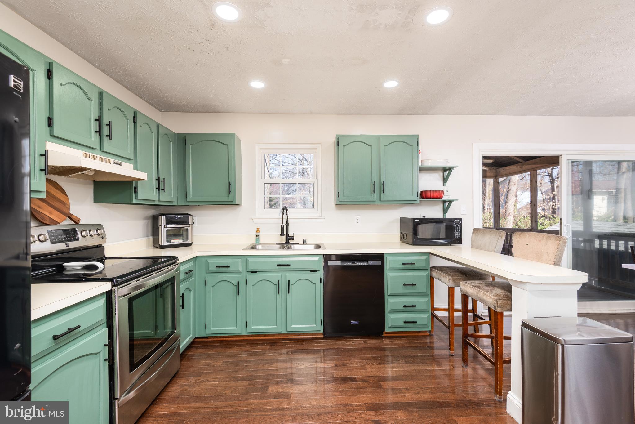 48 Fox Run Way Arnold, MD 21012 - Photo 16 of 33 a kitchen with a sink stove and cabinets