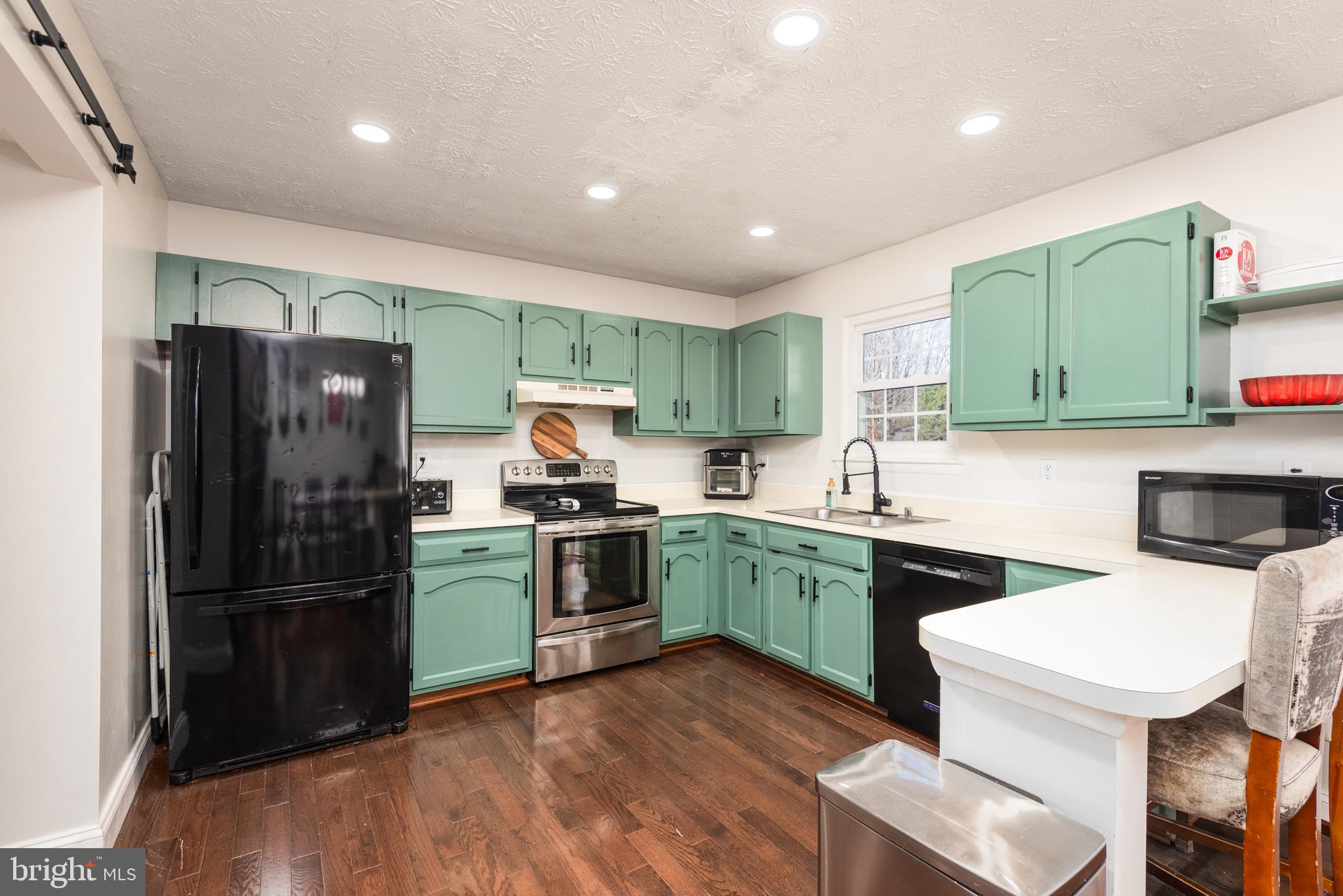 48 Fox Run Way Arnold, MD 21012 - Photo 17 of 33 a kitchen with a sink stainless steel appliances and cabinets