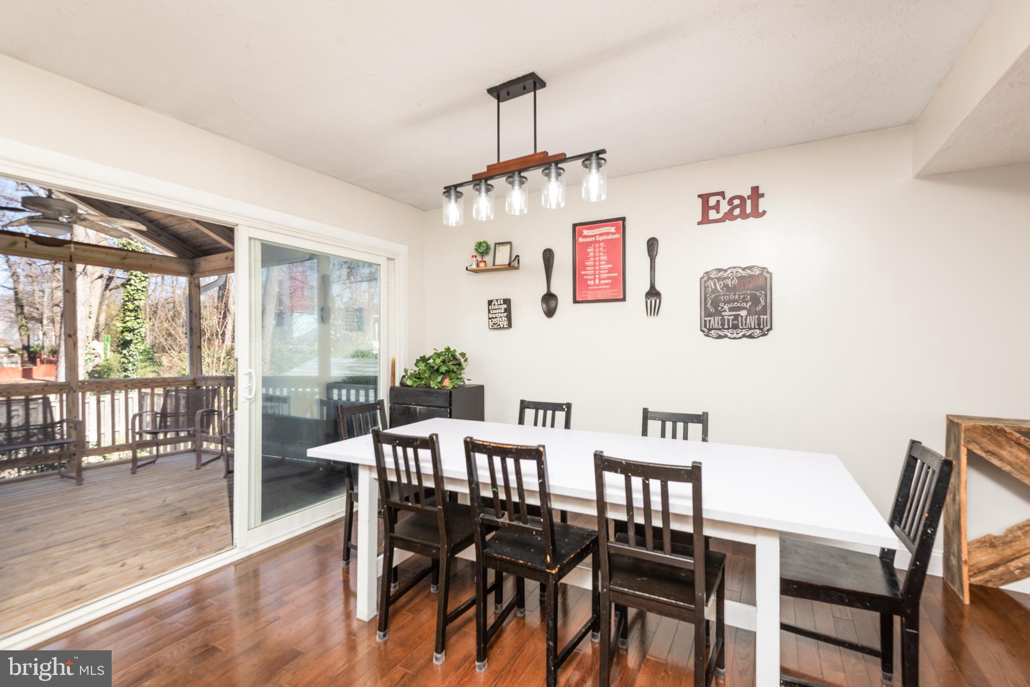 48 Fox Run Way Arnold, MD 21012 - Photo 19 of 33 a view of a dining room with furniture wooden floor and a rug