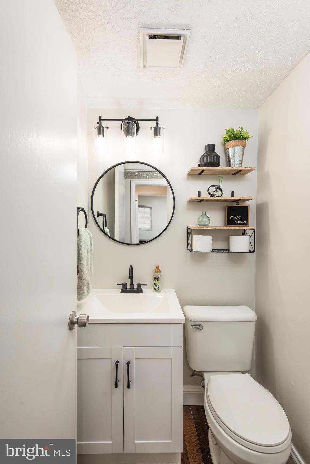 48 Fox Run Way Arnold, MD 21012 - Photo 24 of 33 a bathroom with a sink a toilet and a mirror
