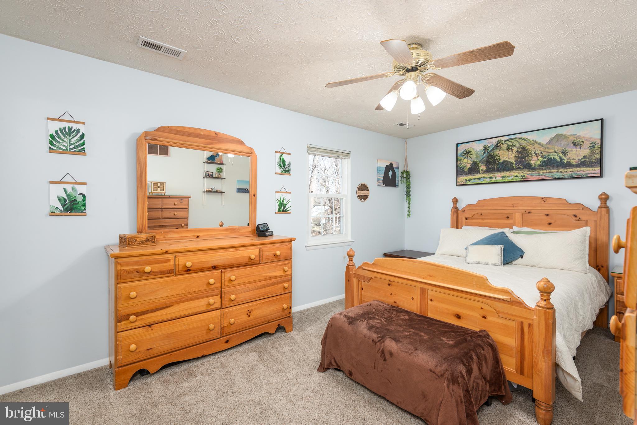 48 Fox Run Way Arnold, MD 21012 - Photo 28 of 33 a bedroom with a bed and a dresser