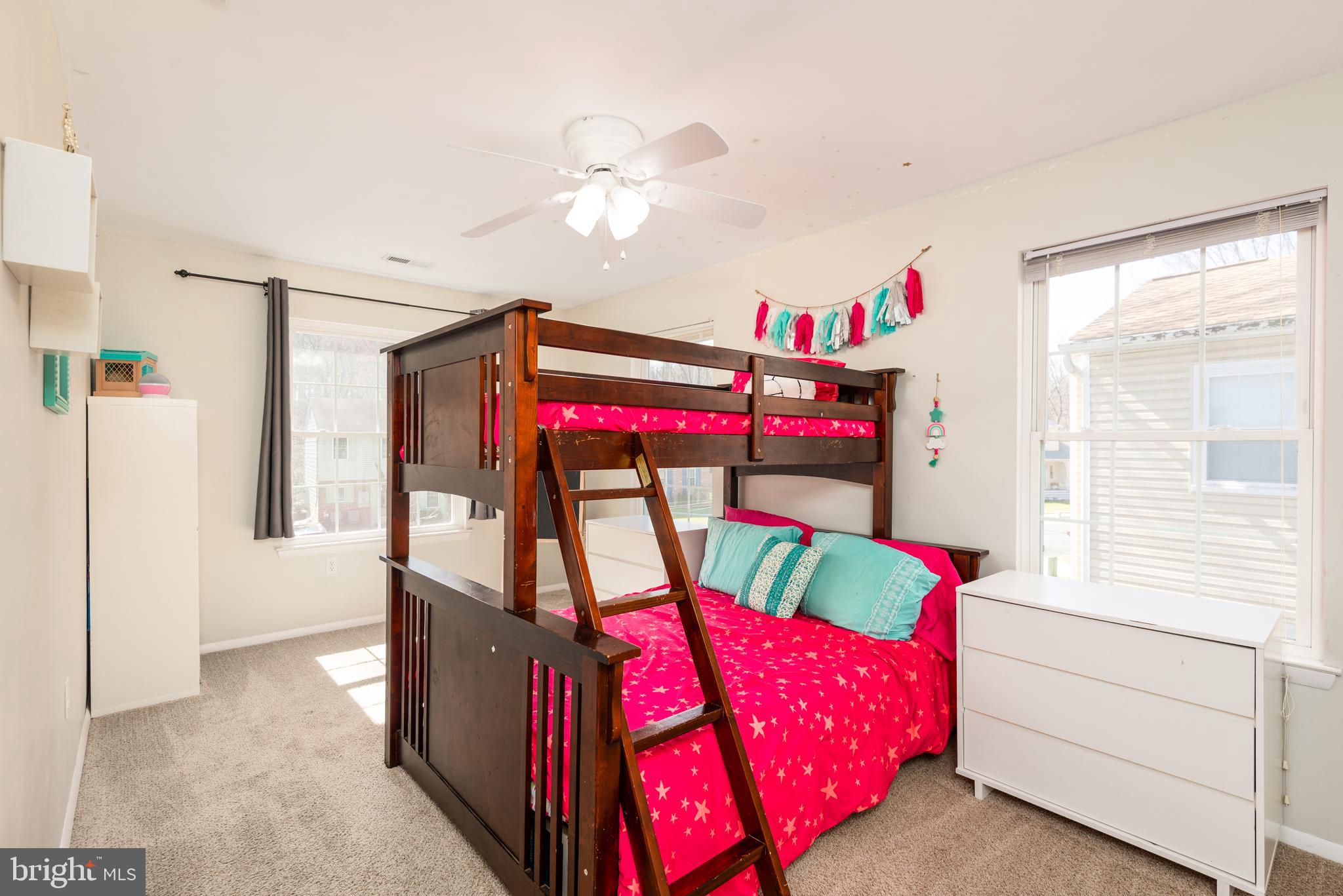 48 Fox Run Way Arnold, MD 21012 - Photo 30 of 33 a bedroom with furniture and a chandelier