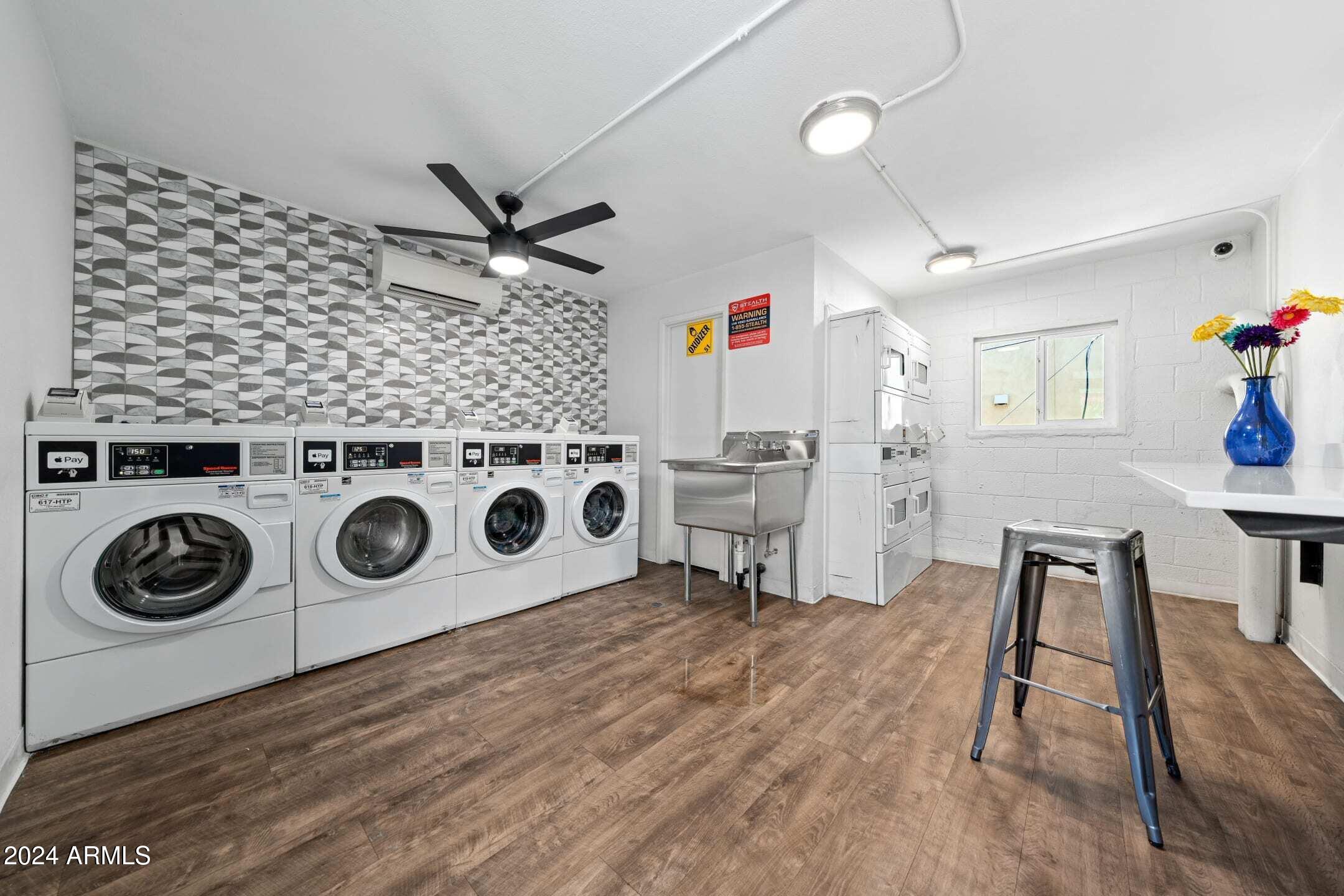 1601 West Camelback Road, Unit E10AE Phoenix, AZ 85015 - Photo 17 of 22 a view of workspace with wooden floor