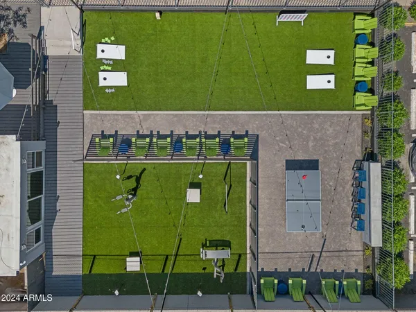 a backyard of a house with seating space and trees