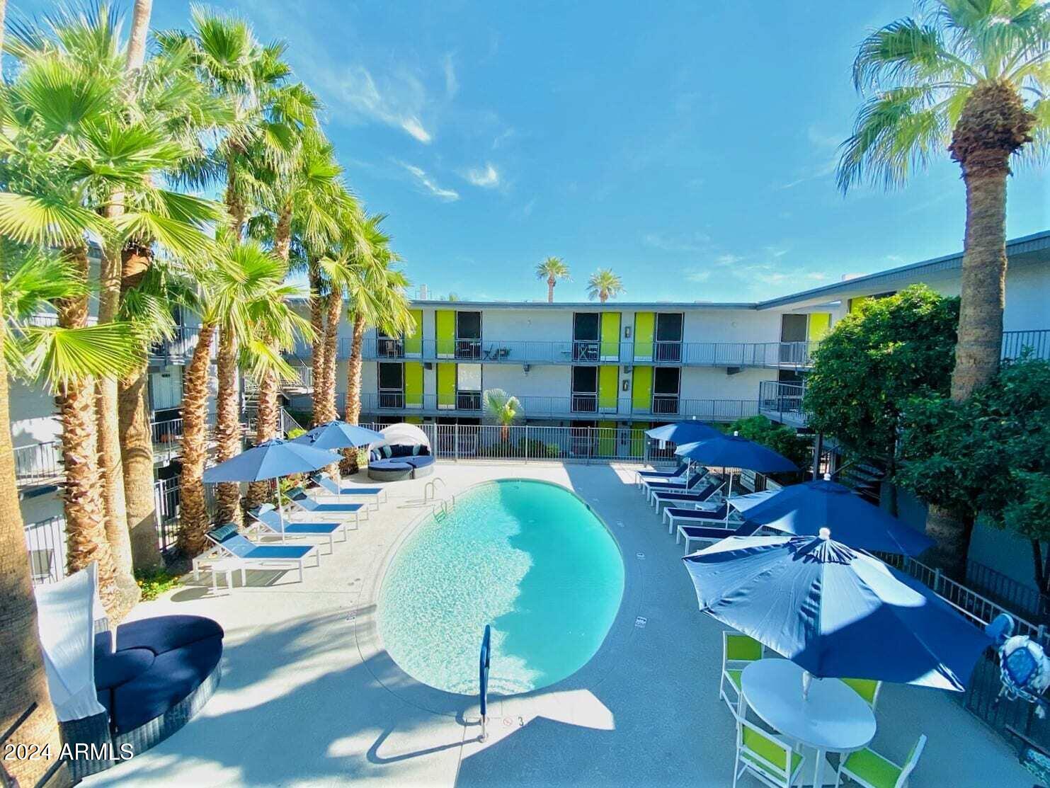 1601 West Camelback Road, Unit E10AE Phoenix, AZ 85015 - Photo 22 of 22 a view of a swimming pool with outdoor seating