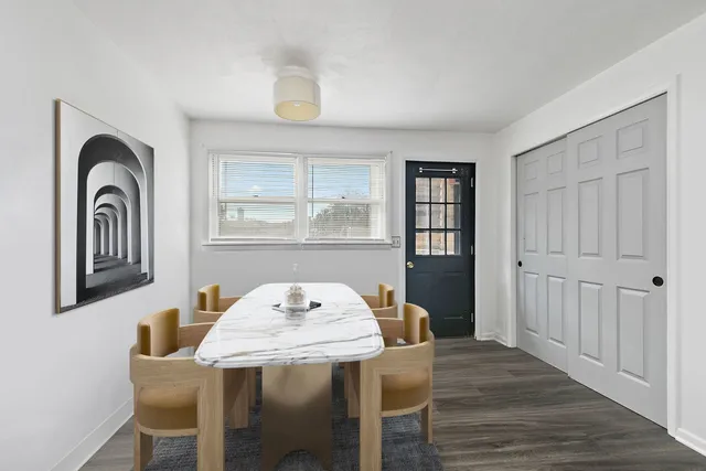 a view of a dining room with furniture and window