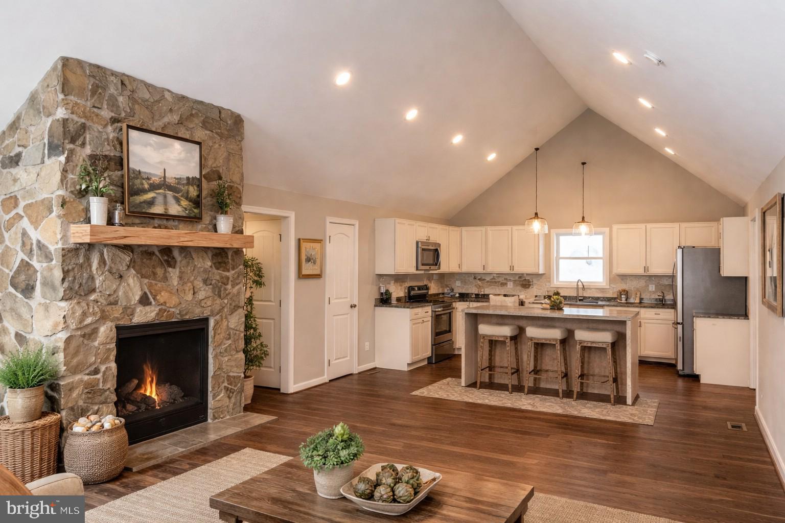 200 Colwood Drive Rileyville, VA 22650 - Photo 4 of 15 a living room with stainless steel appliances furniture a fireplace and a kitchen view