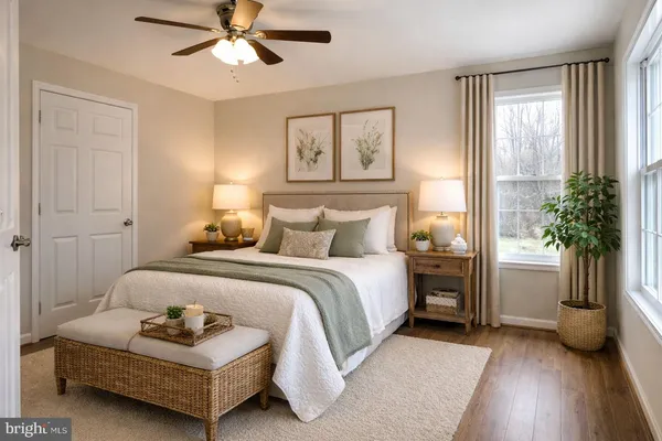 a spacious bedroom with a bed and a chandelier