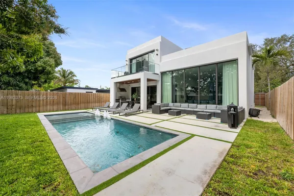 a view of a patio with swimming pool and porch