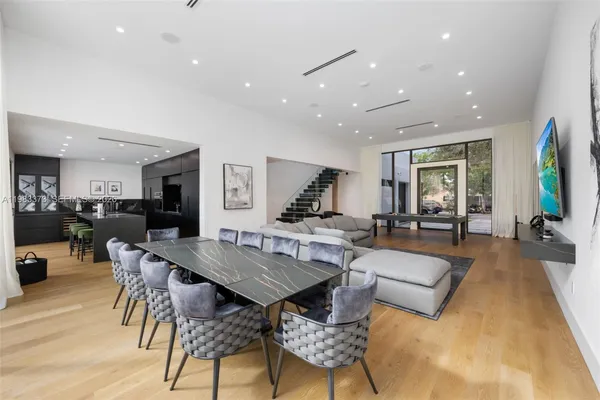 a living room with furniture wooden floor and a rug