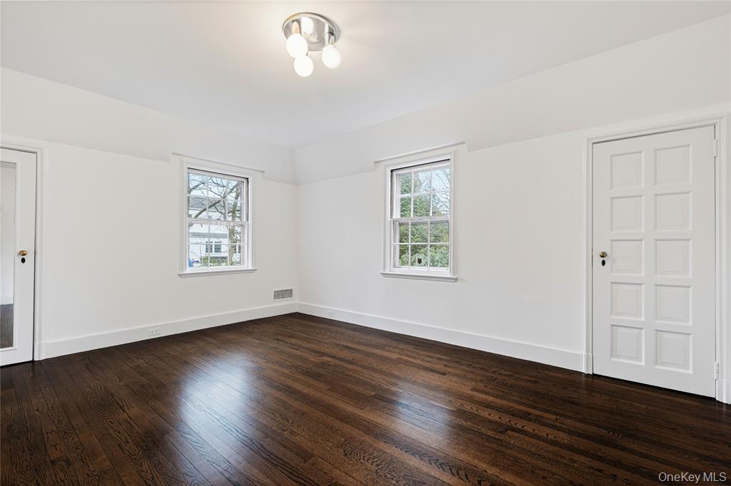 6 Fox Meadow Road Scarsdale, NY 10583 - Photo 15 of 20 Second floor bedroom and dark wood-style floors