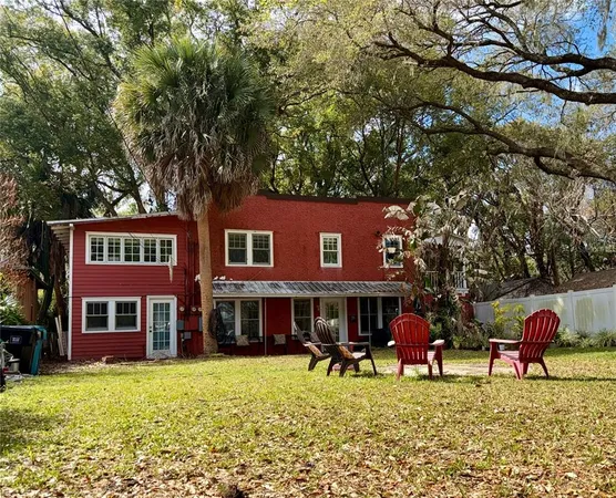 a group of chairs in front of brick building