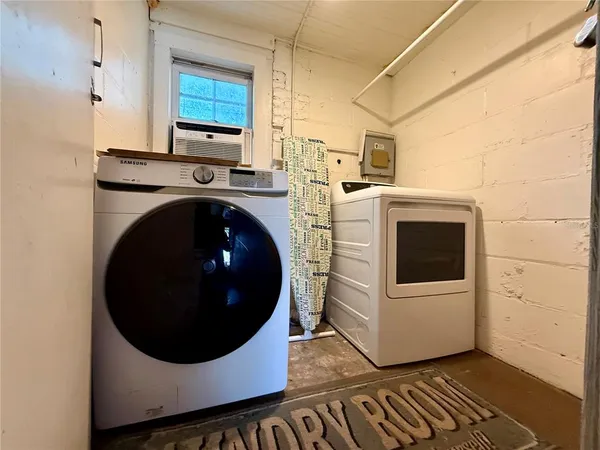 a utility room with dryer and washer