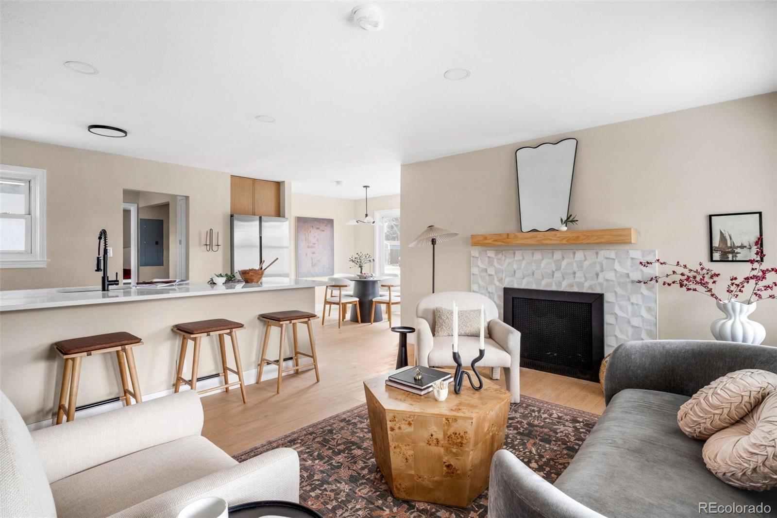 1900 Quebec Street Denver, CO 80220 - Photo 7 of 15 a living room with furniture a fireplace and a large window