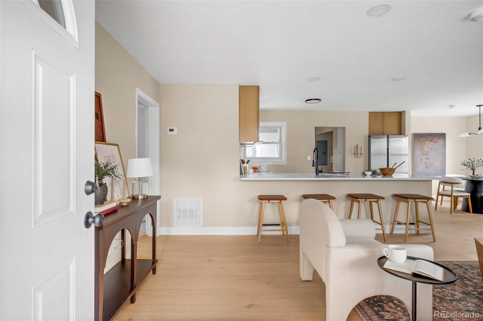 1900 Quebec Street Denver, CO 80220 - Photo 9 of 15 a view of living room kitchen and dining room