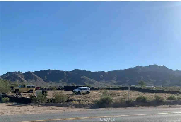 a view of a town with mountains in the background
