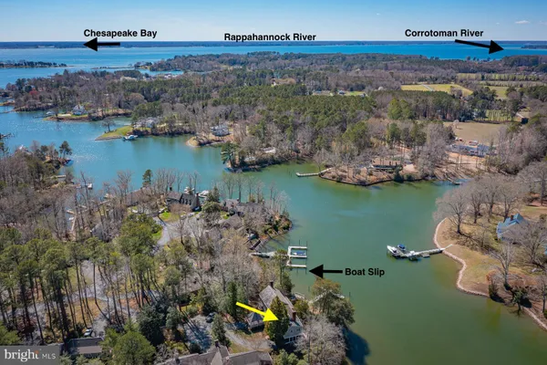 an aerial view of a houses with ocean view