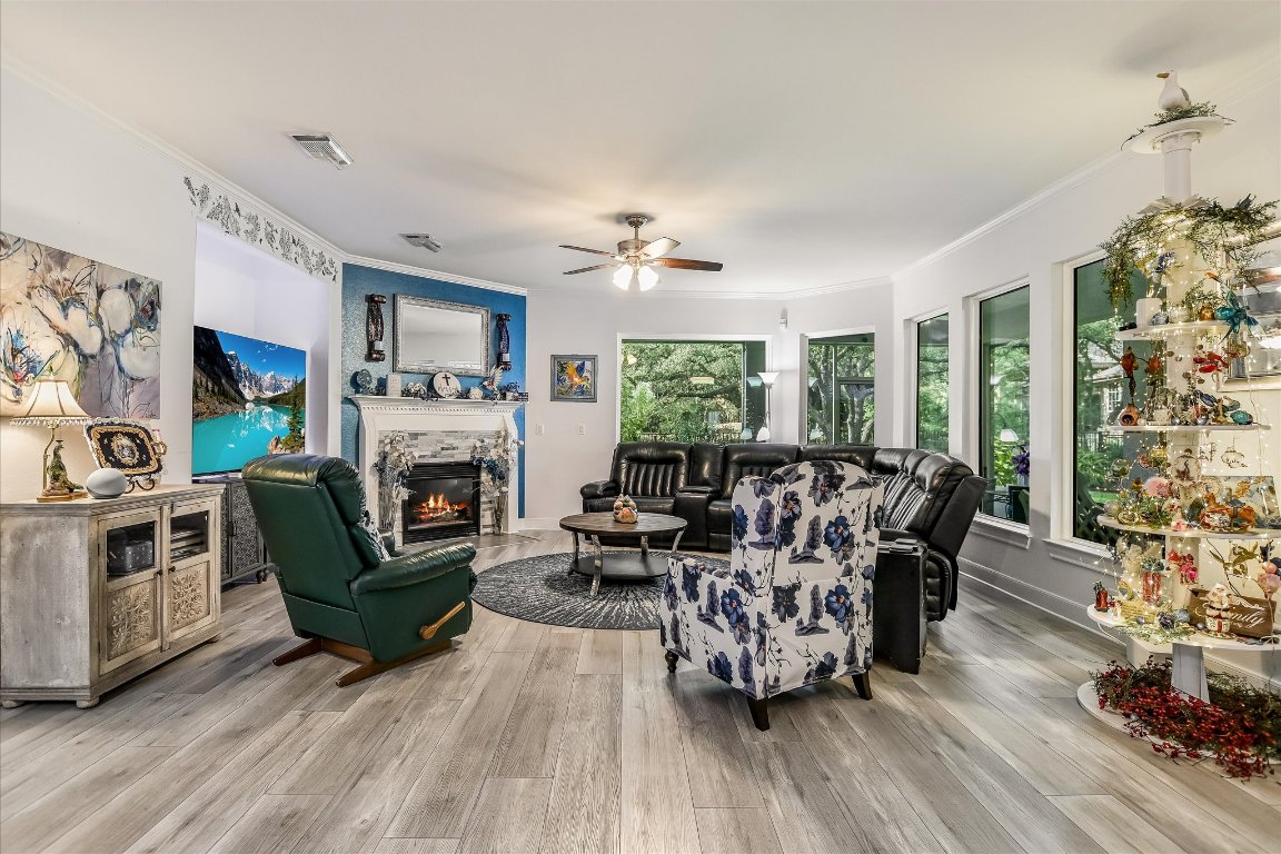 902 Rio Grande Loop Georgetown, TX 78633 - Photo 11 of 29 a living room with furniture a fireplace and a large window