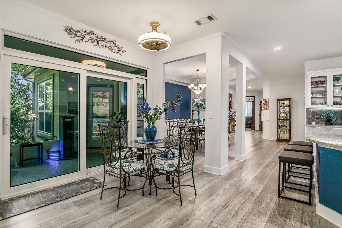 902 Rio Grande Loop Georgetown, TX 78633 - Photo 15 of 29 a view of a dining room with furniture window and wooden floor
