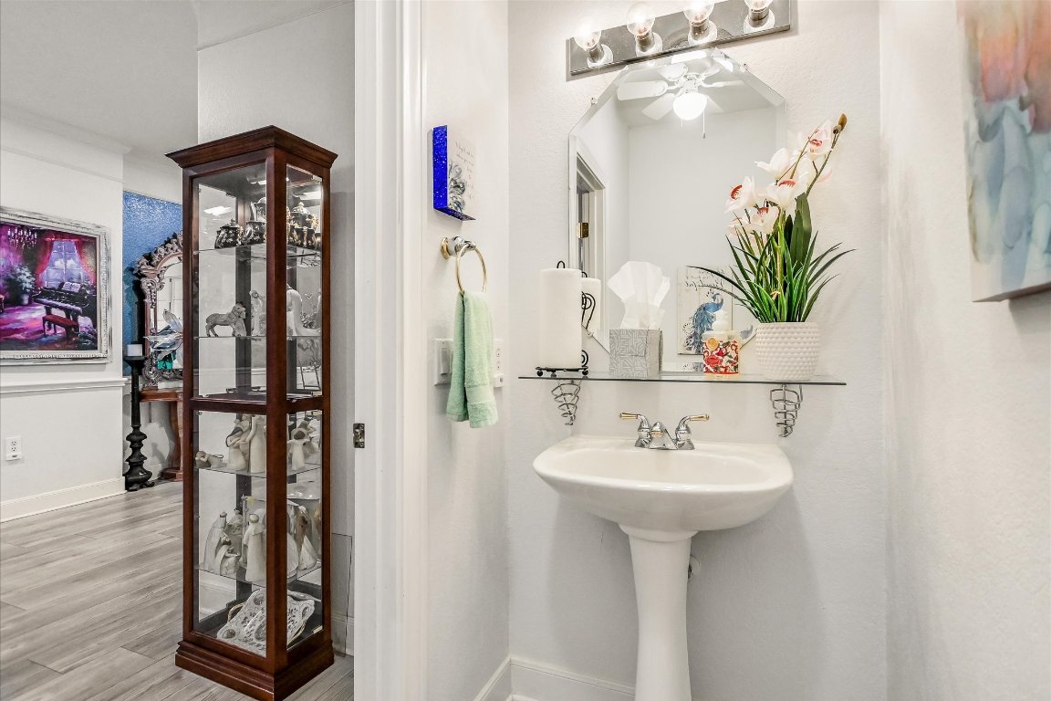 902 Rio Grande Loop Georgetown, TX 78633 - Photo 24 of 29 a bathroom with a sink a mirror and a shower