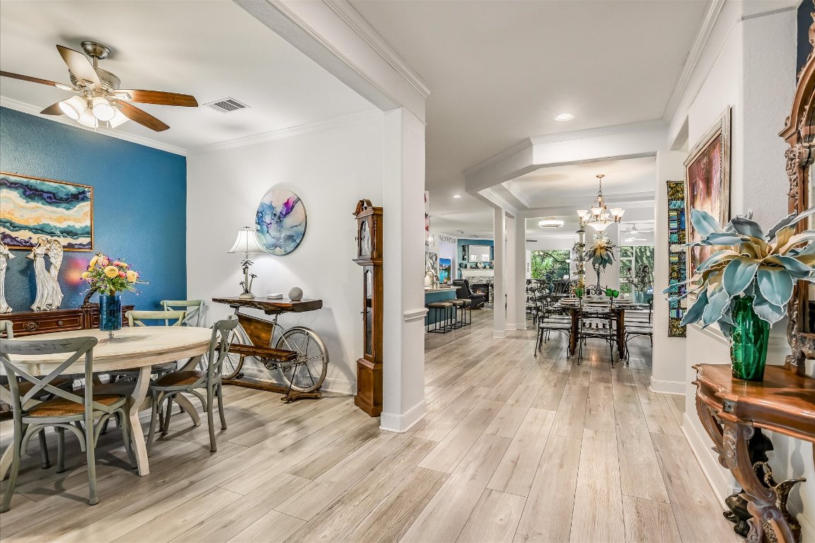 902 Rio Grande Loop Georgetown, TX 78633 - Photo 6 of 29 a view of a dining room with furniture and wooden floor