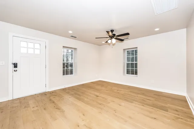 a view of an empty room with a window