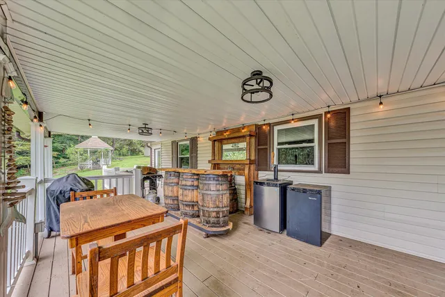 a view of a house with a yard and sitting area