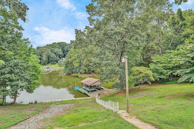 a view of a house with a backyard